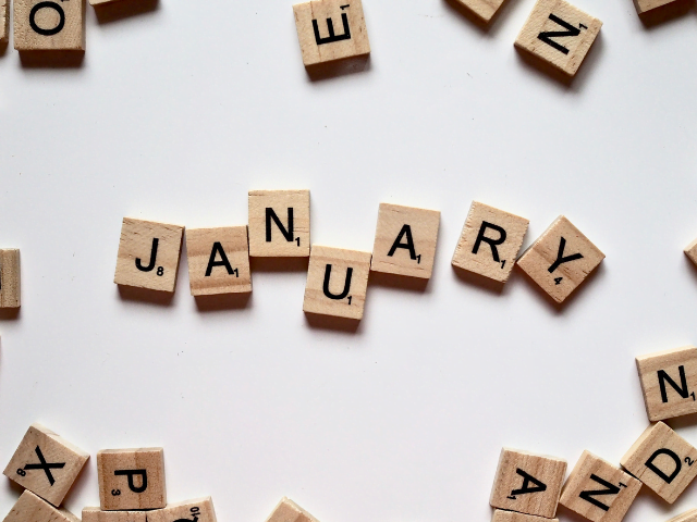 scrabble blocks with letters on spelling out January